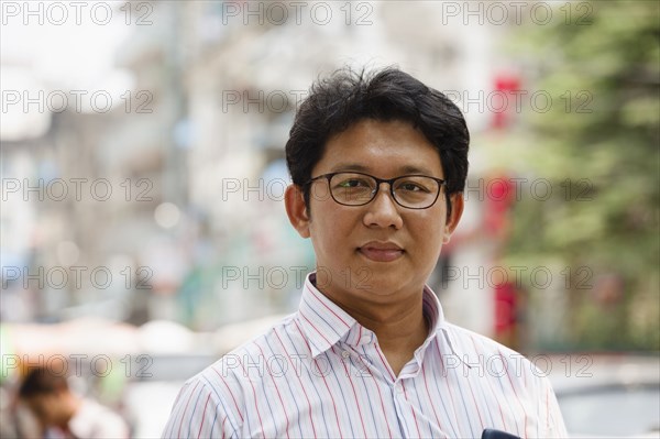 Asian businessman standing in city