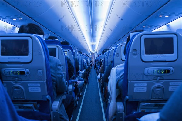 Aisle in full airplane