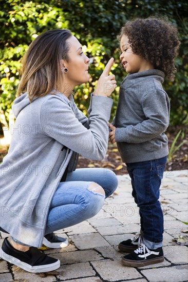 Mother and son playing outdoors