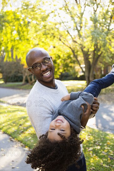 Father playing with son outdoors