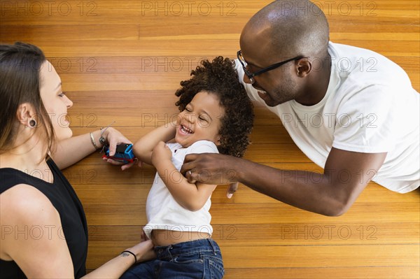 Family playing on floor