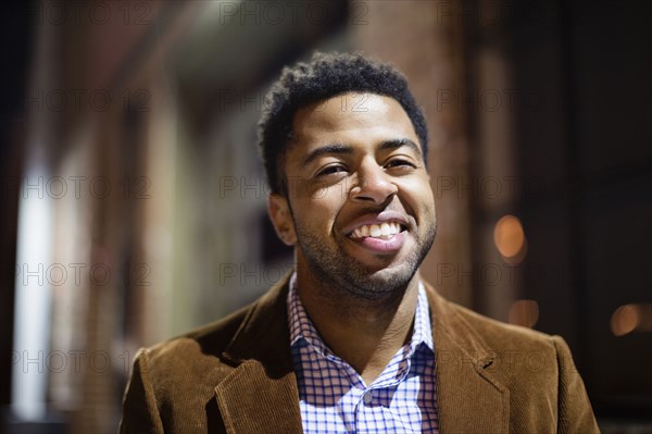 African American businessman smiling outdoors