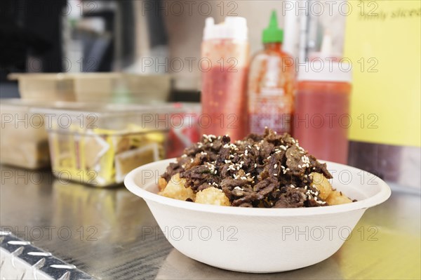 Bowl of food on shelf of food truck