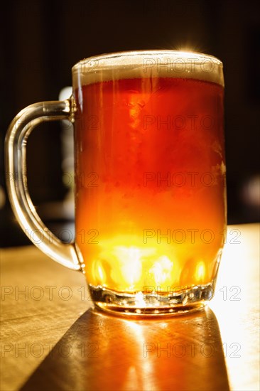 Glass of beer on counter