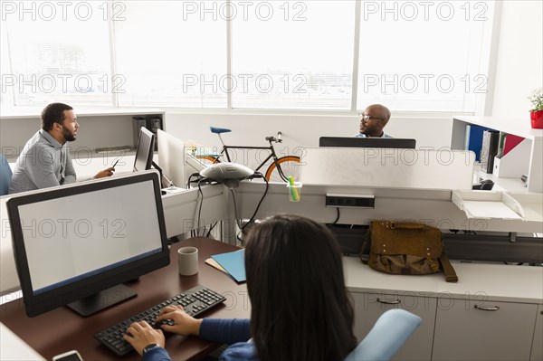 People working at computers in office