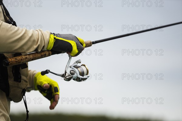 Caucasian man holding fishing rod