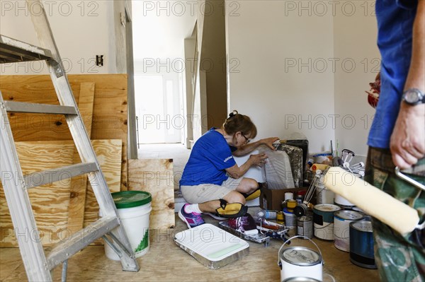 Women preparing to paint walls