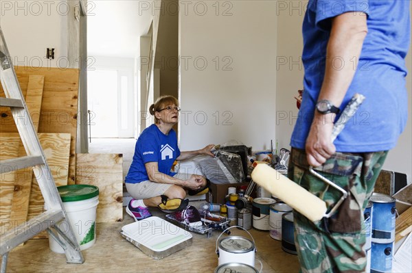 Women preparing to paint walls