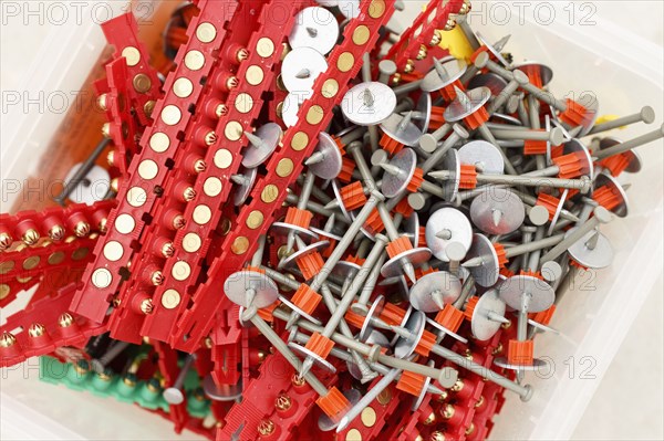 Container of nails and washers