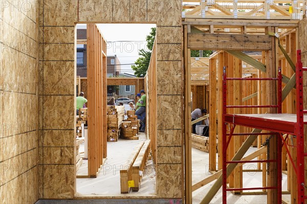 Distant volunteers building house