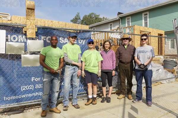 Portrait of volunteers at a construction site