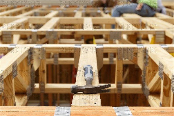 Hammer on the roof at construction site