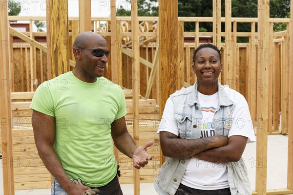 Portrait of smiling men at construction site