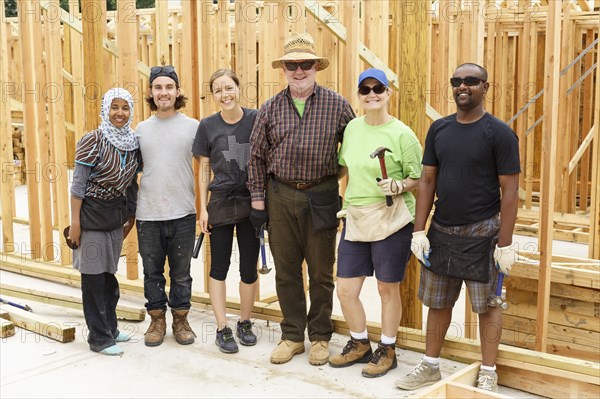 Volunteers posing at construction site