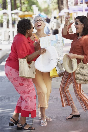 Group of middle-aged woman in the street laughing