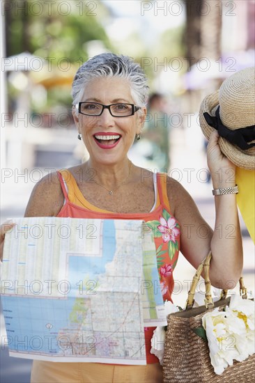 Senior woman holding a map