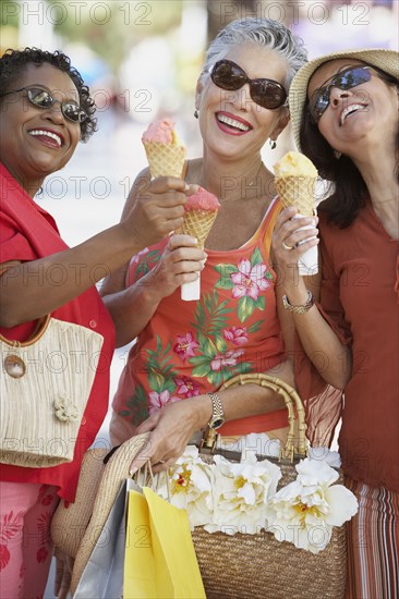 Group of middle-aged women eating ice cream cones