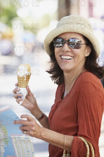 Middle-aged Hispanic woman with ice cream cone