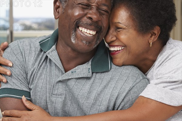 Senior African American couple hugging