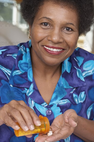 Senior African American woman with medication