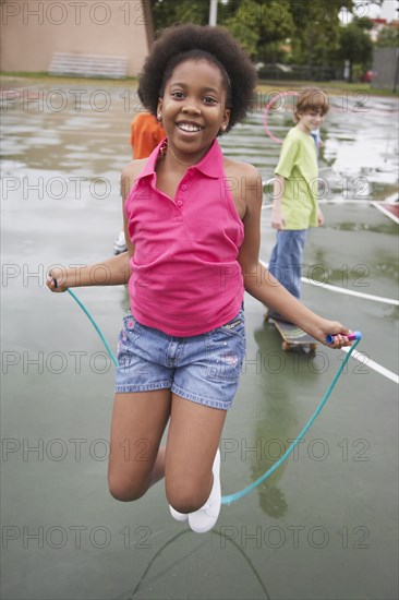 African American girl jumping rope