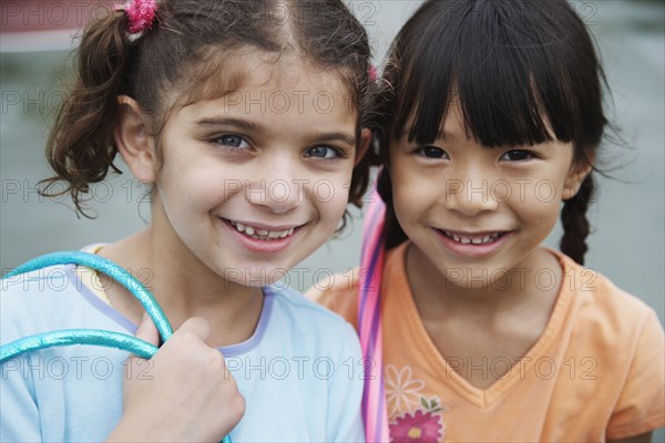 Close up of multi-ethnic girls smiling