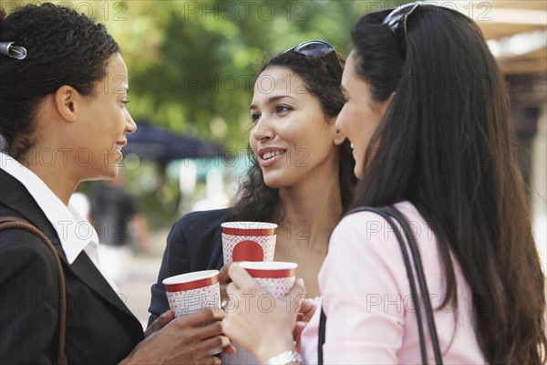 Multi-ethnic friends having coffee