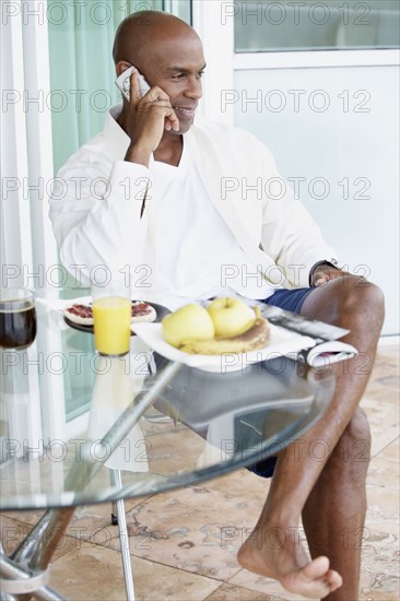 African American man talking on telephone