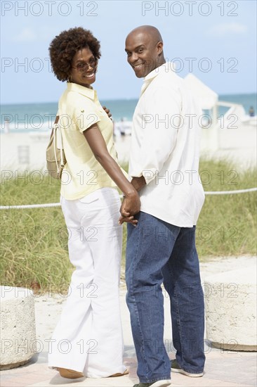 African American couple holding hands