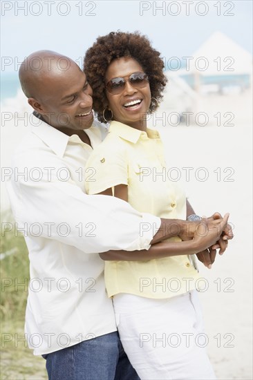 African American couple hugging