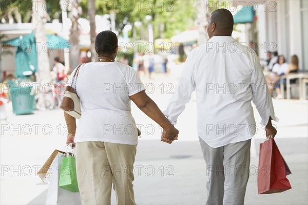 Multi-ethnic couple holding hands