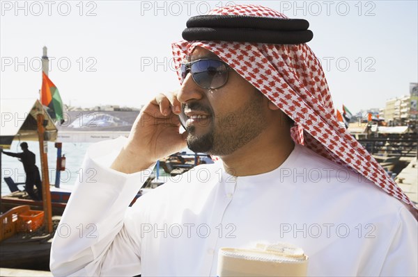 Arab man talking on cell phone