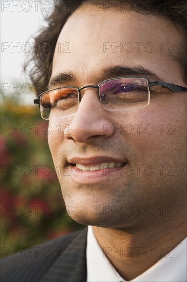 Close up of Indian businessman in eyeglasses