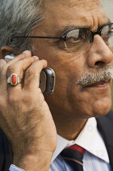 Indian businessman talking on cell phone