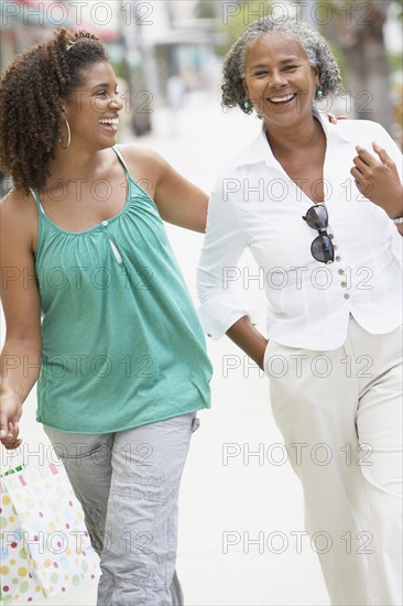 African mother and daughter walking