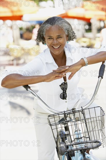 African woman riding bicycle