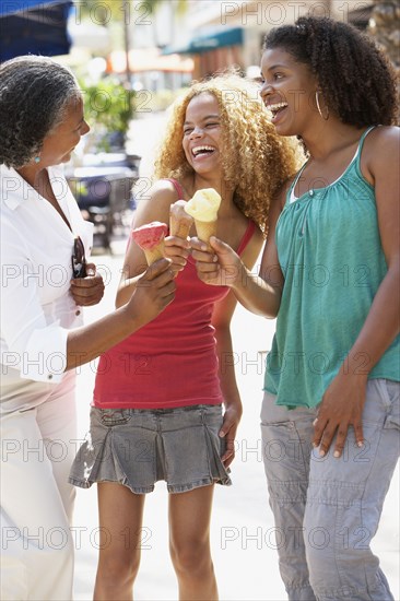 Multi-generational women eating ice cream cones