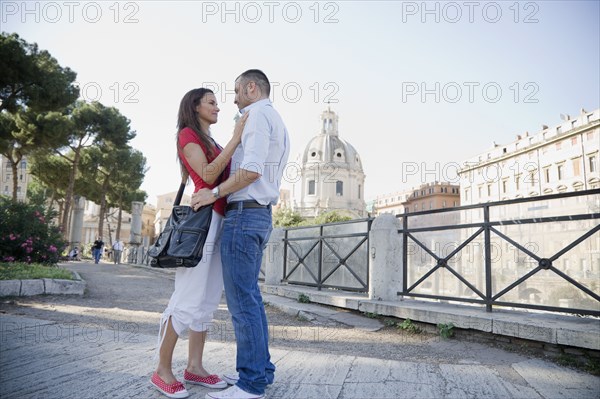 Couple hugging outdoors