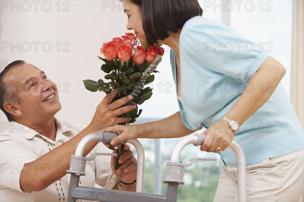 Hispanic man bring wife flowers