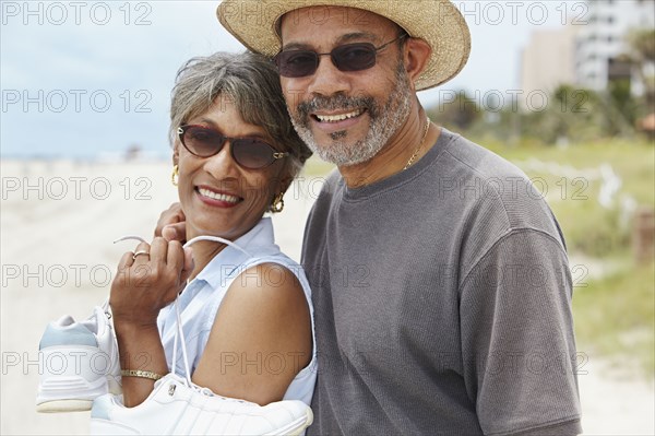 African couple enjoying beach