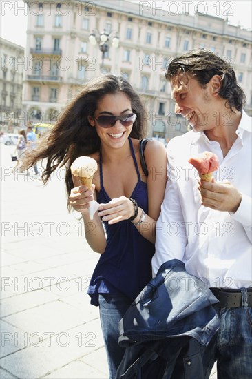 Couple eating ice cream cones