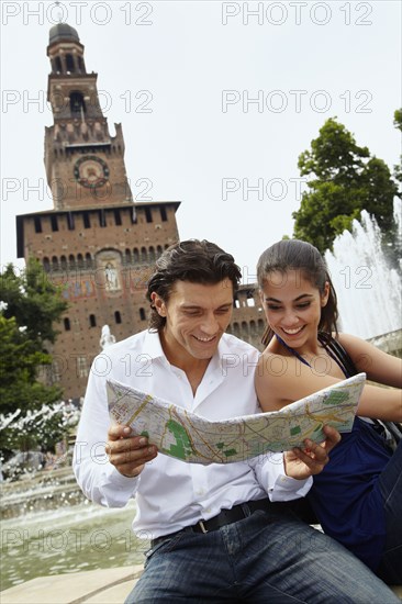 Couple sightseeing and looking at map