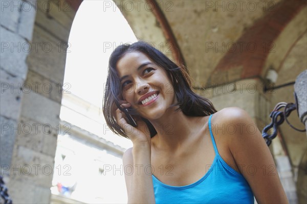 Thai woman talking on cell phone