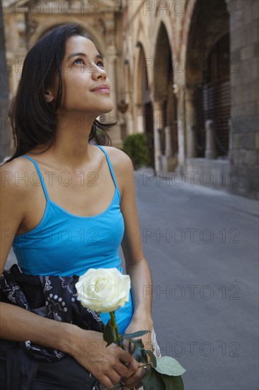 Thai woman holding white rose