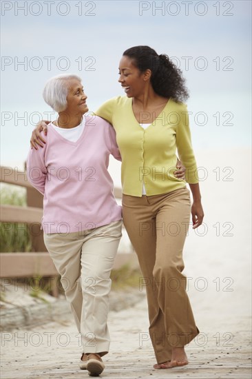 African American woman walking with mother