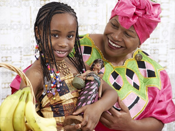 African American girl and grandmother in traditional clothing