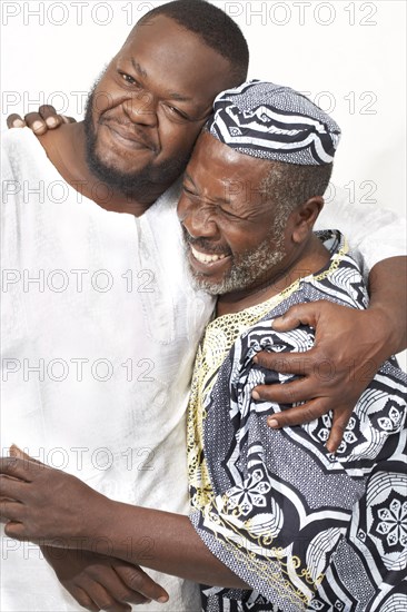 African American father and son hugging