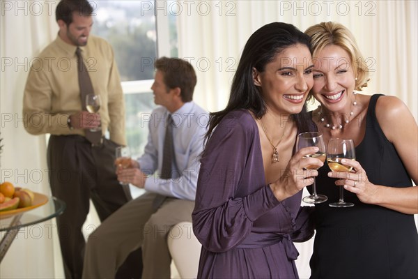 Smiling couples enjoying party