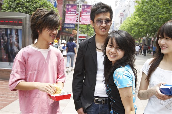 Chinese friends eating fast food together