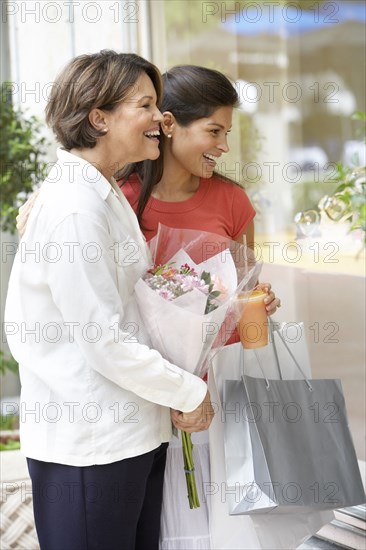 Hispanic mother and daughter shopping together